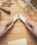 Hands holding wood pieces with 20Pcs Brass Hidden Barrel Hinges 5x25mm Concealed Hinges For Jewelry Boxes, Music Boxes, And Small Woodworking Projects