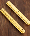 Antique Bronze Decorative Hinges for Wooden Boxes and Cabinets 2 Pack Butt Hinges 100mm by 9mm on wooden surface