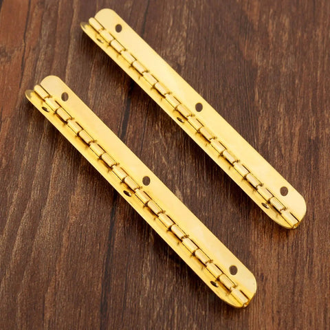 Antique Bronze Decorative Hinges for Wooden Boxes and Cabinets 2 Pack Butt Hinges 100mm by 9mm on wooden surface