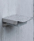 Rock Solid Stainless Steel EV Charging Station Cover For Outdoor Use Featuring Hella Durable Protection, water droplets on surface.