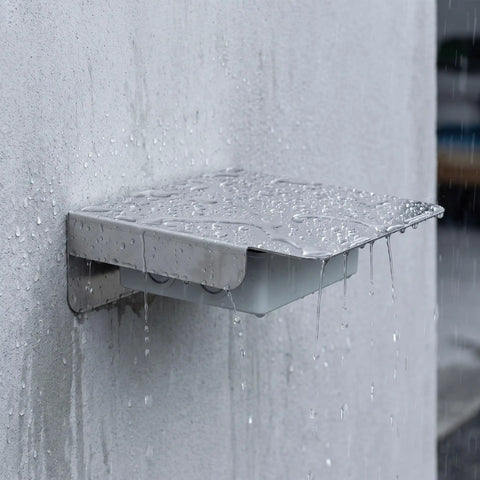Top Shelf Stainless Steel EV Charger Rain Cover For Backyard Or Driveway Setup With Heavy Duty Waterproof Skin protecting against rain.