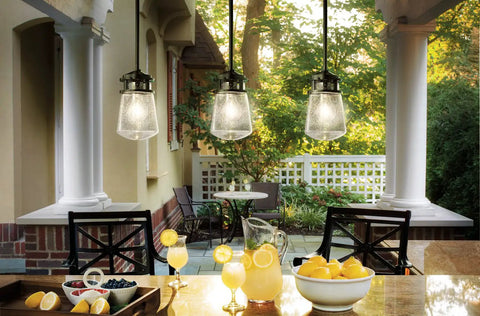Pendant Light With Clear Seeded Glass In Architectural Bronze Finish, One Light, Nine And A Half Inch Diameter over kitchen island