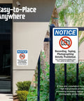 Heavy Duty Aluminum Bilingual Privacy Warning Sign Rock Solid For Outdoors Straight Up No Recording Or Taping Allowed Top Shelf Rust Resistant Security Notice 10X14 Inches mounted on a wall and fence.