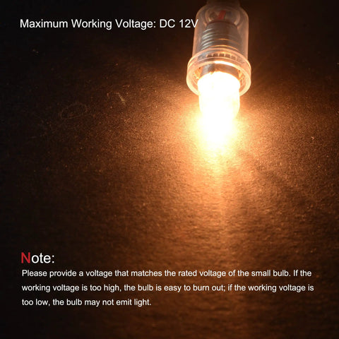 Top Shelf E10 Screw Base Miniature Bulbs delivering a crisp warm yellow glow, plugged into a dark surface with visible glow.