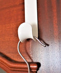 Over The Door Hook Set White Plastic Hanger For Coats Towels And Accessories Easy Install Door Mount Rack in use on wooden door