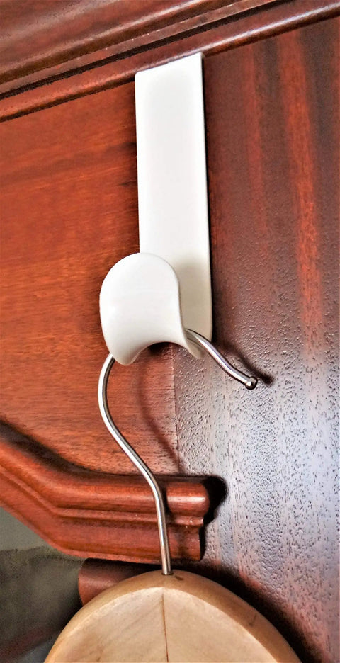 Over The Door Hook Set White Plastic Hanger For Coats Towels And Accessories Easy Install Door Mount Rack in use on wooden door