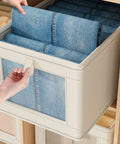 No Stress Foldable Storage Cubes With Heavy Duty Dual Handles For Thick Blankets Linens And Winter Jackets Fast To Flatten And Stack Away Every Single Day with rolled denim inside a stylish storage cube.