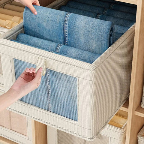 No Stress Foldable Storage Cubes With Heavy Duty Dual Handles For Thick Blankets Linens And Winter Jackets Fast To Flatten And Stack Away Every Single Day with rolled denim inside a stylish storage cube.