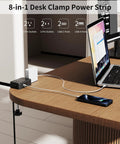 No Fuss 8 In 1 Desk Clamp Power Strip With 4 Outlets And 4 USB Ports, Includes 2 USB C, mounted on wood desk with charging phone