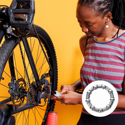 Person repairing bike with Bicycle Crank Ball Bearing Set One Fifth Inch 6mm Ball Size With Nine Balls Per Bearing Two Pack