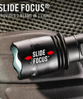 Close-up of Beastly Bright 4000 Lumen USB C Rechargeable LED Flashlight with Slide Focus feature on textured surface