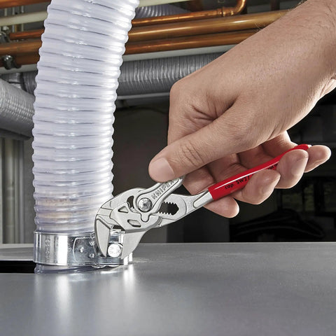 Hand using adjustable pliers wrench set 6 inch 7 inch 10 inch with smooth jaws and push button lock on plumbing pipe