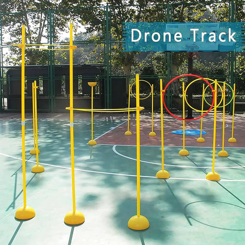 Image of Dope Drone Racing Practice Kit For Game Enthusiasts, Portable Obstacle Course Set with yellow poles and hoops on outdoor court.