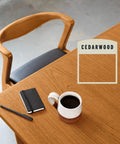 Fast Track Cedarwood Wood Stain For Home Updates One Pass Slick Protection Quick Cure applied on a wooden desk with coffee.