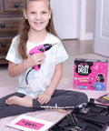 Girl holding Girls Power Drill Set With Realistic Drilling Action 60 Piece Tool Kit Rechargeable Cordless Pink Drill With LED Light