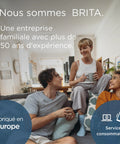 Two adults and one woman relaxing on a couch, promoting BRITA's family-owned business with over 50 years of experience.