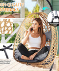 Hanging Egg Chair With Stand For Patio And Garden Wicker Swing Hammock Style With 350 lbs Capacity in Yellow Gray on porch