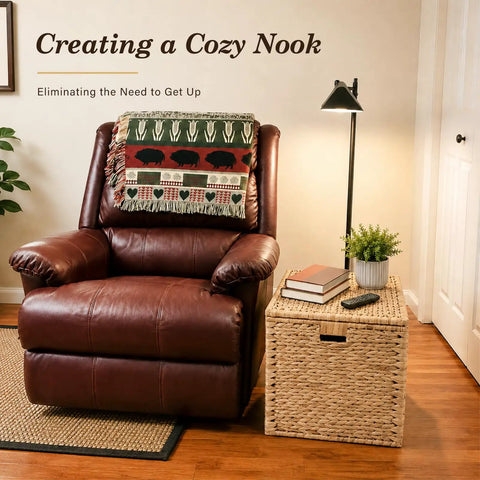 Handwoven Water Hyacinth Storage Trunk With Lid And Handles next to leather armchair, rustic wicker storage chest with books