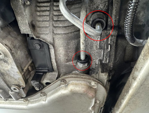 View of vehicle transmission showing Automatic Transmission Cooler Line Fittings Kit With Long And Short Connectors for Chevy leak fix