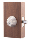 Satin Stainless Single Cylinder Deadbolt With ANSI Grade 3 Security on a wood block, side view showing steel cylinder guard.