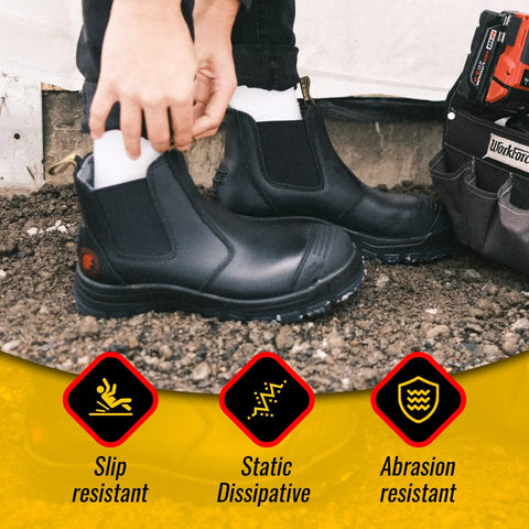 Mens 6 Inch Steel Toe Work Boots With Pull On Safety Leather Chelsea Design Static Dissipative Construction Durable Leather Safety Shoes For Job Sites US 14 Half Size Up Recommended being worn on a construction site with slip and abrasion resistance features highlighted.