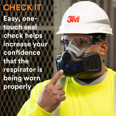 Worker demonstrating Half Face Respirator With Secure Click Fit Speaking Diaphragm And Push Button Seal Check Quad Flow Cartridges HF802SD.
