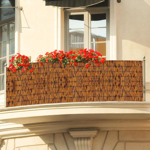Natural Reed Bamboo Fencing Light Russet For Outdoor Privacy Screen on balcony with red flowers, handwoven reed curtains.