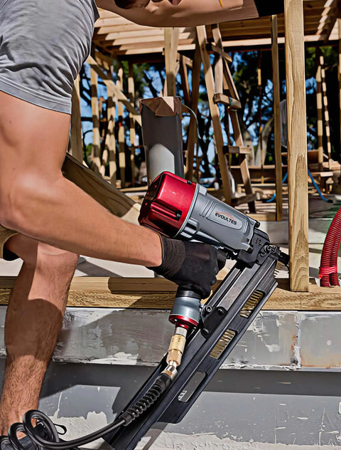 Man using nail gun with 1/4 In Polyurethane Recoil Air Hose With 28 Ft Length, Brass Fittings, in a construction setting