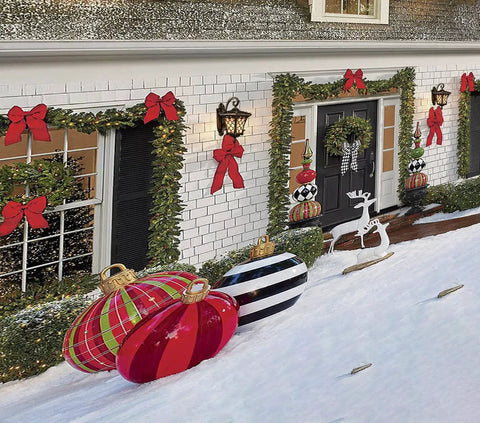Festive home with Outdoor Wall Lantern With Tiffany Glass Shade, weatherproof black and brass finish, amid holiday decorations.