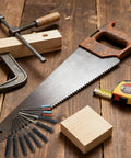 12 Piece Comprehensive Extractor Kit with saw, clamp, and tape measure on a wooden surface