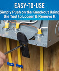 Hand using Panel Buddy Knockout Set for front and rear knockouts easy removal from electrical panels embedded in drywall