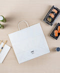 Sturdy White Paper Shopping Bags With Handles 14.2 By 8.3 By 13.2 Inches 100 Pack Durable Grocery Gift Bags with sushi arrangement