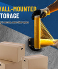 Wall Mountable Stretch Film Roll Stand Fits Up To 20 Inch Film Core Great For Industrial Manufacturing And Logistics Use Holds 2 And 3 Inch Core Rolls Includes 7 Screws For Easy Mounting Keeps Shrink Wrap Organized, mounted on wall with boxes below.