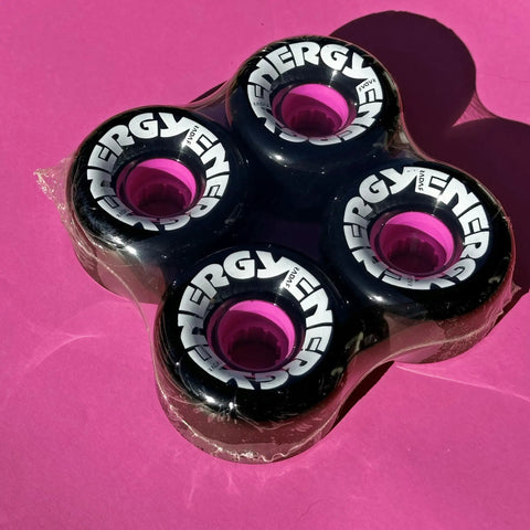Energy 65 Quad Roller Skate Wheels Set For Outdoor Rolling, 78A Urethane, 35mm X 65mm, 4 Pack In Black on pink background