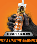 Front view of Gorilla 100% silicone sealant cartridge, 10 oz, white, all-purpose, held by a gorilla hand.