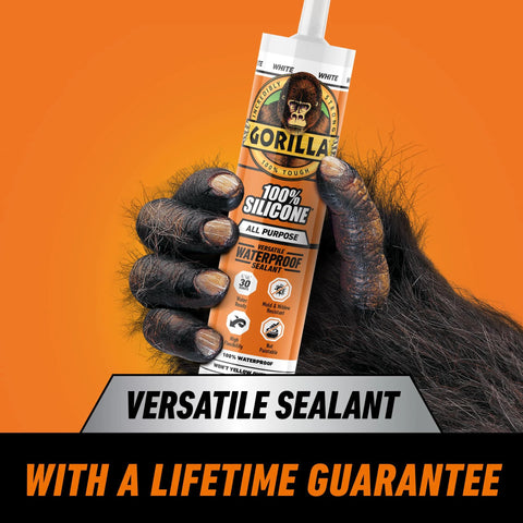 Front view of Gorilla 100% silicone sealant cartridge, 10 oz, white, all-purpose, held by a gorilla hand.