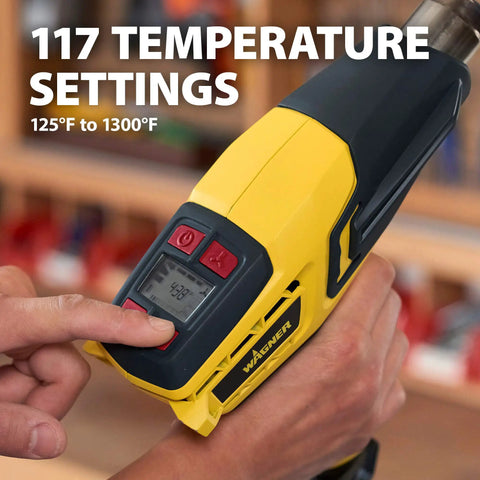 Person adjusting temperature on FURNO 700 Digital Heat Gun With 2 Nozzles, Adjustable 125 To 1300 F Temperature And Multiple Fan Speeds