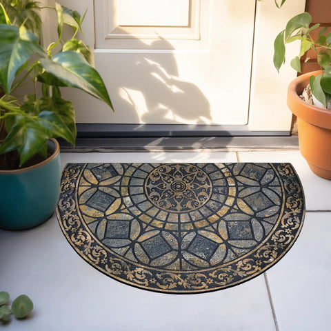 Semi-circular decorative outdoor doormat with intricate pattern near an entrance, surrounded by potted plants.