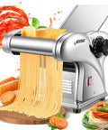 Newtry Electric Pasta Maker Machine With 3 Interchangeable Blades For Homemade Noodles creating fresh spaghetti on a wooden board.