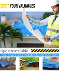 Engineer reviewing plans with blue 20x30ft poly tarp covering roof, showcasing Built Tough Heavy Duty Poly Tarp.