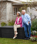 Beefy Westwood 150 Gallon Resin Outdoor Storage Box For Patio Furniture Cushions Garden Tools And Pool Floats, Seats Two, in garden scene