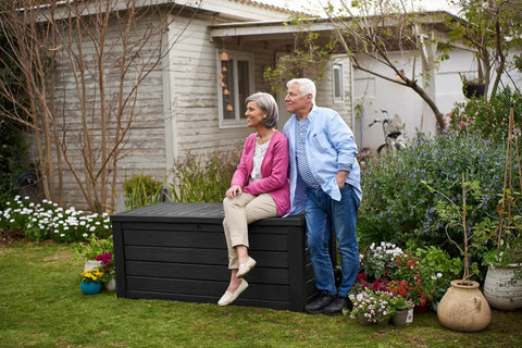 Beefy Westwood 150 Gallon Resin Outdoor Storage Box For Patio Furniture Cushions Garden Tools And Pool Floats, Seats Two, in garden scene
