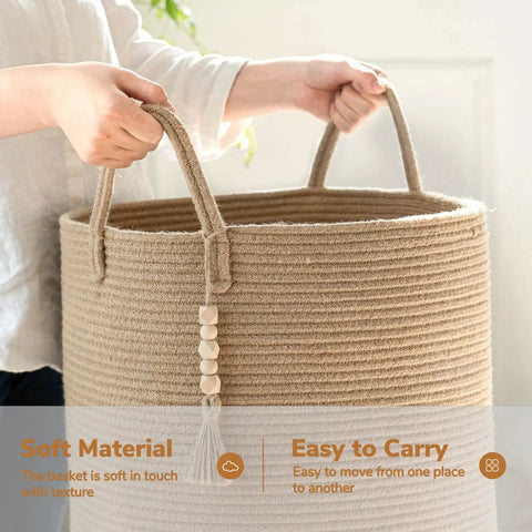Person holding a Boho Jute Laundry Hamper Basket With Handles Tall Wicker Hamper for Nursery and Laundry Room, 16 by 20 inches