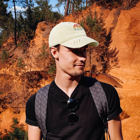 Yacht Vibes No Crying On The Yacht Inspired Cotton Baseball Cap for men, cream color, worn outdoors, showing side view with sunlight.