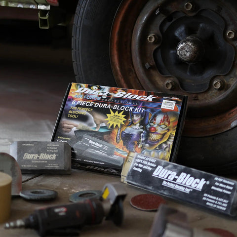 Six Piece Flexible EVA Foam Auto Body Sanding Block Kit for Wet or Dry Sanding shown near car wheel and tools.