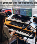 Musician using Double X Keyboard Stand And Bench Set For Digital Pianos With Adjustable Height And Lockable Straps Fits 49 61 76 And 88 Keys Built To Last Beefy Steel Construction Powder Coated Rust Proof Stand And Stool in studio
