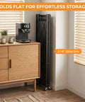 Heavy Duty 4 Tier Foldable Storage Shelf, Massive Rolling Wire Rack With Pivoting Casters, Dead Simple Tool Free Assembly, Total Game Changer Cube Organizer For Kitchen Pantry Garage Or Home Office, Black, folded compactly beside a coffee machine.