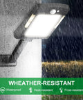 Solar Powered Outdoor LED Lights With Motion Sensor, 48 LEDs Flood Light, showing weatherproof design in rain, mounted on wall.