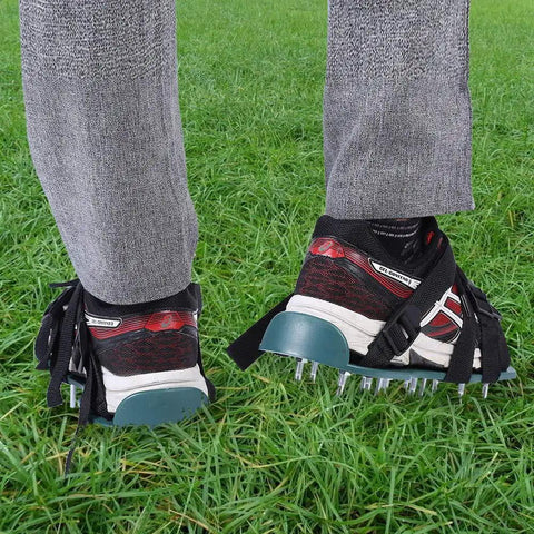 Pre Assembled Lawn Aerator Shoes with spiked metal grips, adjustable straps for men and women on grass.