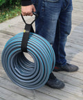 Person holding coil with Eight Pack Heavy Duty Extension Cord Organizer With 60 Lb Capacity For Cords Hoses And Tools Adjustable Strap System With Carabiners For Easy Garage Storage And Organization